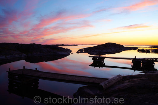 125517 - Bryggor i solnedgång